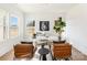 Bright office space with large windows, modern decor, a neutral color palette, and two leather chairs at 2095 Tite Rd, Stanfield, NC 28163