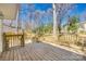 New wooden deck and railing with steps to backyard at 2123 Purser Dr, Charlotte, NC 28215