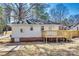 Exterior view of the home with a new wooden deck and nice backyard at 2123 Purser Dr, Charlotte, NC 28215