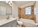 Bathroom with a tub, a tiled shower, and large vanity at 2123 Purser Dr, Charlotte, NC 28215