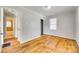 Bedroom boasting hardwood floors, closet, and attached bathroom at 2123 Purser Dr, Charlotte, NC 28215