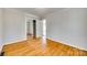 Bedroom featuring hardwood floors, and sliding mirror closet at 2123 Purser Dr, Charlotte, NC 28215
