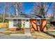 Charming single-story home with brick and siding, featuring a well-manicured lawn and inviting entrance at 2123 Purser Dr, Charlotte, NC 28215