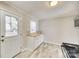 Updated kitchen with stainless appliances, butcher block counters, and a door to the backyard at 2123 Purser Dr, Charlotte, NC 28215