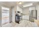 Well-lit kitchen boasts stainless steel appliances, butcher block countertops, and neutral walls at 2123 Purser Dr, Charlotte, NC 28215