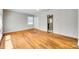 Bright living room featuring hardwood floors, neutral paint, and an open doorway to the entryway at 2123 Purser Dr, Charlotte, NC 28215
