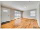 Spacious living room with hardwood floors, natural light, and neutral walls create a calming atmosphere at 2123 Purser Dr, Charlotte, NC 28215