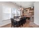 The dining room boasts a unique wood accent wall, a stylish chandelier, and a built-in wine fridge at 234 Iverson Way, Charlotte, NC 28203