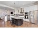 Open kitchen with granite counters, stainless appliances, large island with breakfast bar seating at 234 Iverson Way, Charlotte, NC 28203