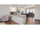 A stylish kitchen with white cabinets, stainless steel appliances, and a dining area creates a functional and inviting space at 234 Iverson Way, Charlotte, NC 28203