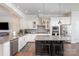 Bright kitchen featuring stainless appliances, granite counters, and dark island with barstool seating at 234 Iverson Way, Charlotte, NC 28203