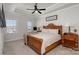 Main bedroom suite features tray ceiling, a ceiling fan, and a large window at 234 Iverson Way, Charlotte, NC 28203