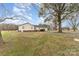 Large backyard with mature tree provides shade, with driveway leading to rear of property at 24697 Ramsey Dr, Albemarle, NC 28001