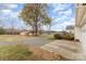 This property boasts an expansive backyard with mature trees and a tranquil pond view, perfect for outdoor enjoyment at 24697 Ramsey Dr, Albemarle, NC 28001