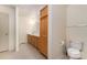 Bathroom featuring a double sink vanity, ample storage, and a separate toilet area at 24697 Ramsey Dr, Albemarle, NC 28001