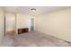 This carpeted bedroom is a blank canvas, awaiting personal touches to transform it into a cozy sanctuary at 24697 Ramsey Dr, Albemarle, NC 28001