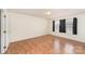 A well-lit room with hardwood floors and neutral walls offers a versatile space for relaxation and personalization at 24697 Ramsey Dr, Albemarle, NC 28001