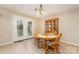 Cozy dining area with tiled floors, a wooden table set, and adjacent access to the exterior at 24697 Ramsey Dr, Albemarle, NC 28001