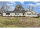 Charming single-story home featuring vinyl siding, a well-maintained lawn, and beautiful landscaping at 24697 Ramsey Dr, Albemarle, NC 28001