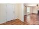 Inviting foyer featuring hardwood floors and a view into the living room, creating a warm welcome at 24697 Ramsey Dr, Albemarle, NC 28001