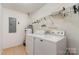 Well-organized laundry room equipped with modern washer and dryer units, maximizing space and efficiency at 24697 Ramsey Dr, Albemarle, NC 28001