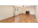 Spacious living room with a cozy fireplace, a ceiling fan, and natural light, ready for relaxation at 24697 Ramsey Dr, Albemarle, NC 28001