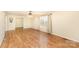 Inviting living room with hardwood floors, ceiling fan, and natural light, creating a comfortable atmosphere at 24697 Ramsey Dr, Albemarle, NC 28001