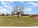 Spacious yard with mature trees leading to a lake with view of home at 24697 Ramsey Dr, Albemarle, NC 28001