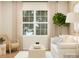 Cozy living room featuring a large window, comfortable seating, and contemporary decor at 250 Tackle Box Dr, Troutman, NC 28166