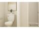 Cozy powder room with a modern toilet and a decorative plant, creating a fresh and clean space at 250 Tackle Box Dr, Troutman, NC 28166