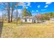 View of the spacious yard with a wood fence around the perimeter at 2625 Larry Dr, Charlotte, NC 28214