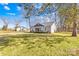 Single-story home with well-maintained lawn, fresh landscaping, and inviting entryway at 2625 Larry Dr, Charlotte, NC 28214
