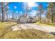 Single-story home with sunny front yard, fresh landscaping, and inviting entryway at 2625 Larry Dr, Charlotte, NC 28214