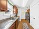 Modern kitchen with wood cabinets, granite countertops, stainless steel appliances, and hardwood floors at 2625 Larry Dr, Charlotte, NC 28214