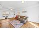 Bright living room with hardwood floors, comfortable seating, and natural light, with views of yard at 2625 Larry Dr, Charlotte, NC 28214