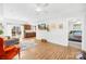 Bright living room with wood floors, neutral decor, and seamless flow into the kitchen and bedroom at 2625 Larry Dr, Charlotte, NC 28214