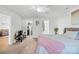 Bright main bedroom features a ceiling fan, carpet, and ensuite bathroom and walk-in closet at 2625 Larry Dr, Charlotte, NC 28214