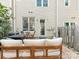 Cozy outdoor space featuring comfortable seating and serene backyard views at 2658 Dilworth Heights Ln, Charlotte, NC 28209