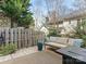 Inviting backyard with a comfortable seating area, lush greenery, and privacy fencing at 2658 Dilworth Heights Ln, Charlotte, NC 28209