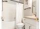 A clean, bright bathroom with subway tile shower, a white vanity, and updated fixtures at 2658 Dilworth Heights Ln, Charlotte, NC 28209