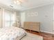Bright bedroom featuring hardwood floors, decorative artwork and a comfortable rug at 2658 Dilworth Heights Ln, Charlotte, NC 28209
