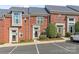 Charming brick townhome with well-maintained landscaping and designated parking spaces at 2658 Dilworth Heights Ln, Charlotte, NC 28209