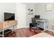 Modern office space with a large desk, stylish storage, and dark hardwood floors at 2658 Dilworth Heights Ln, Charlotte, NC 28209