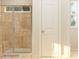 Bathroom featuring tiled shower with glass door and a small window at 2810 Morning Song Way, Lancaster, SC 29720