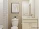 Modern bathroom with a white vanity, framed art, and a shower with a patterned curtain at 2810 Morning Song Way, Lancaster, SC 29720