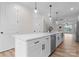 Bright kitchen featuring a large island with stainless steel dishwasher and pendant lighting at 3206 Riley Ave, Charlotte, NC 28269