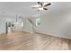 Spacious open-concept living area connects seamlessly to a modern kitchen and staircase, bathed in natural light at 3206 Riley Ave, Charlotte, NC 28269