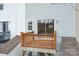 Wooden balcony overlooking the backyard with a sliding glass door entrance at 331 Wilkes Place Dr, Fort Mill, SC 29715