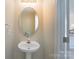 Charming half bathroom with pedestal sink and classic fixtures at 331 Wilkes Place Dr, Fort Mill, SC 29715