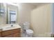 Bathroom with shower, toilet, vanity, and mirror at 331 Wilkes Place Dr, Fort Mill, SC 29715